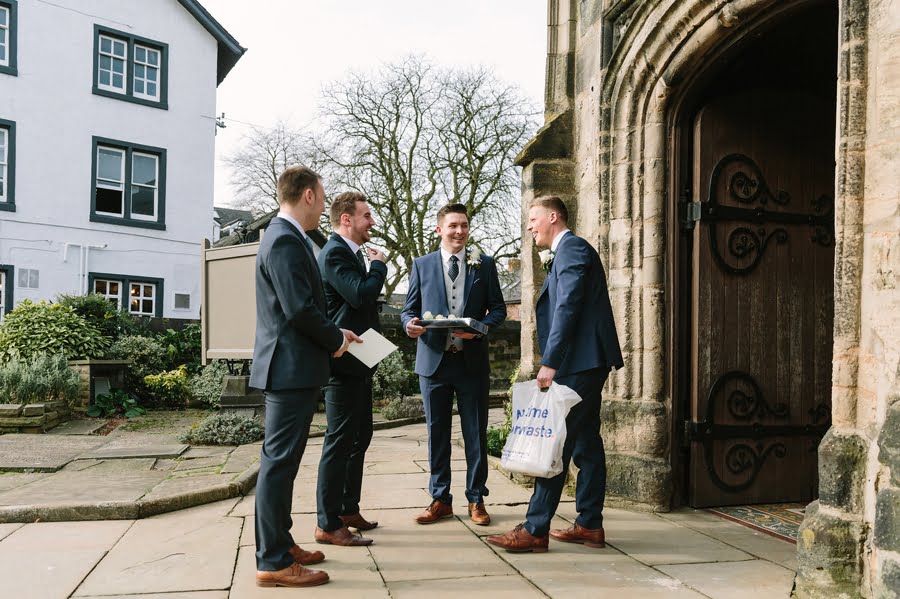 groom outside cheshire church wedding
