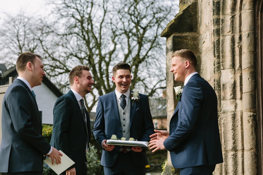 groom outside cheshire church wedding