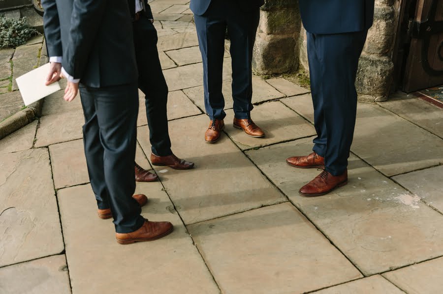 groom outside cheshire church wedding