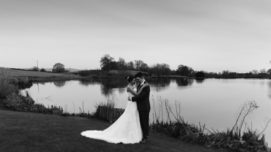 bride and groom at sandhole oak barn wedding lake