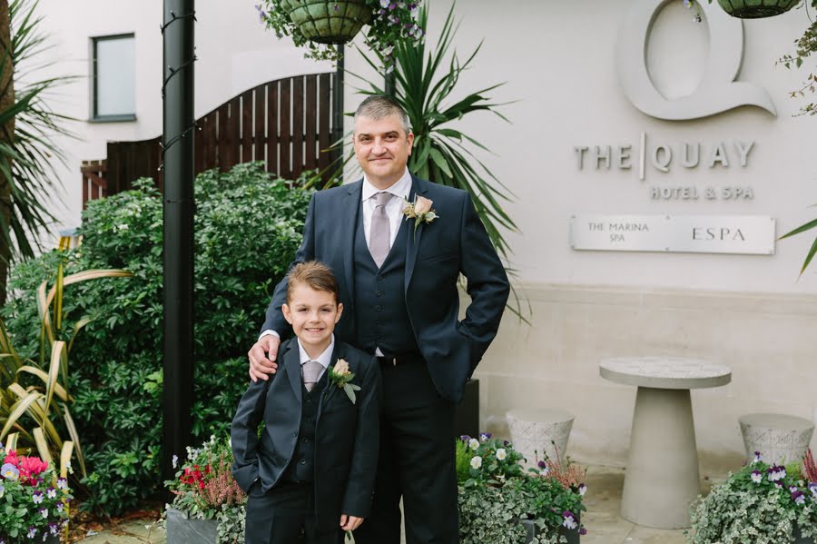 groom and son at Quay hotel and spa wedding