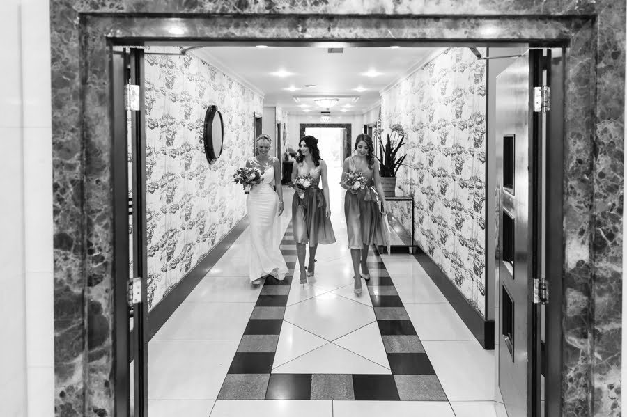 bride and bridesmaids walking to the ceremony at Quay hotel and spa wedding