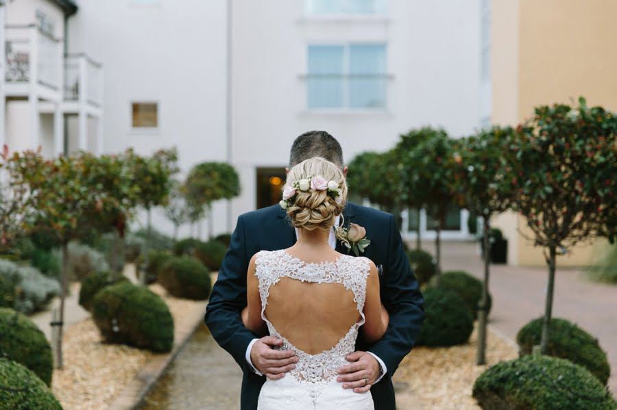 bride and groom in courtyard at Quay hotel and spa wedding