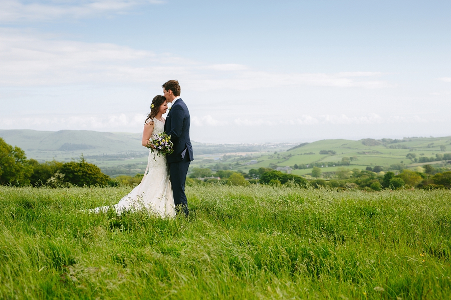 beautiful bride and groom in a field