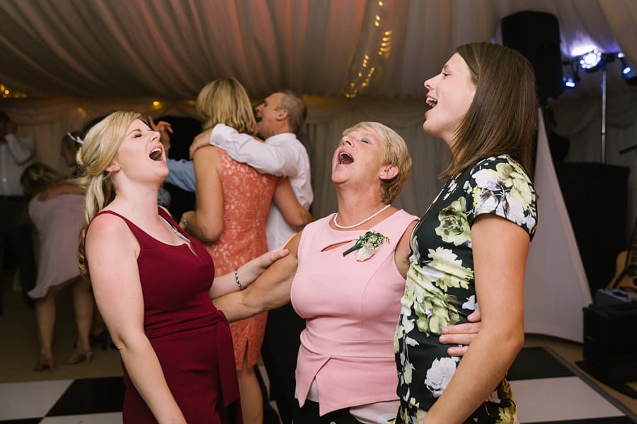 wedding guests singing
